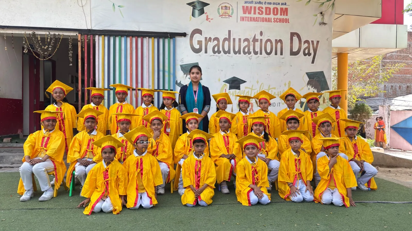 Graduating students and teachers at Wisdom International School